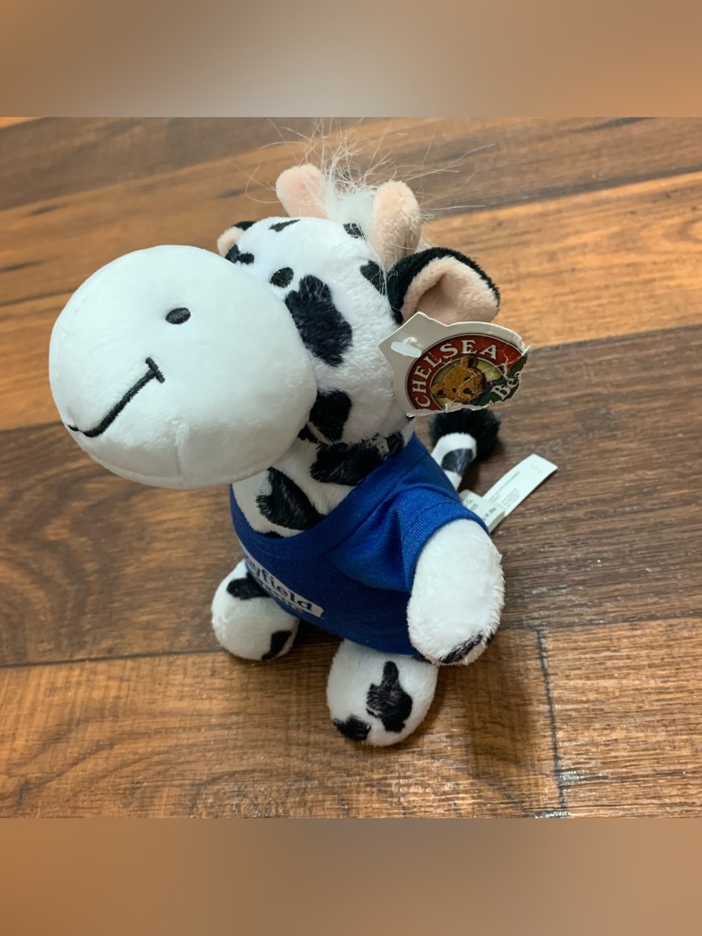 Stonyfield Organic cow plush toy with a blue branded t-shirt